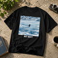 But Why Penguin black graphic tee shown as a tabletop flat lay