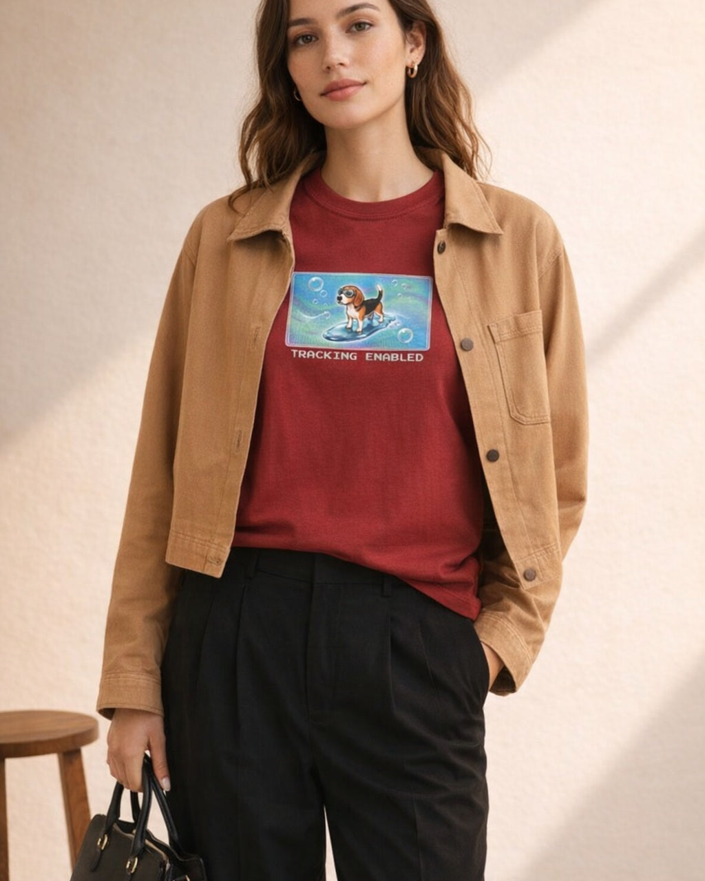 O's Tees Tracking Enabled Beagle Frutiger Aero Dogs graphic tee lifestyle image — Cardinal Red shirt, female shot 02, black trouser camel jacket