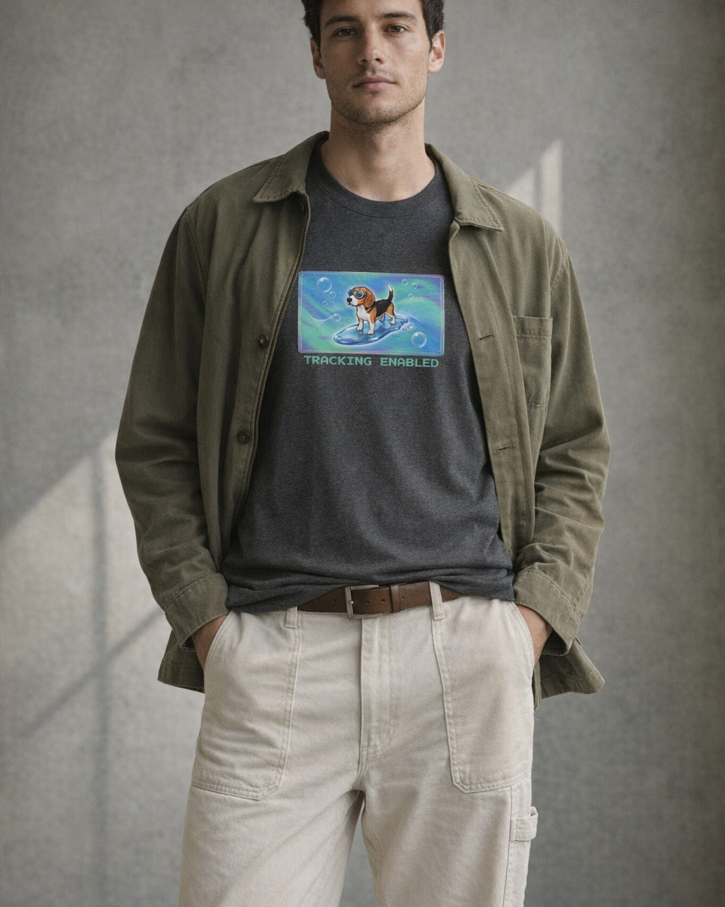 O's Tees Tracking Enabled Beagle Frutiger Aero Dogs graphic tee lifestyle image — Dark Heather shirt, male shot 01, ecru carpenter olive field