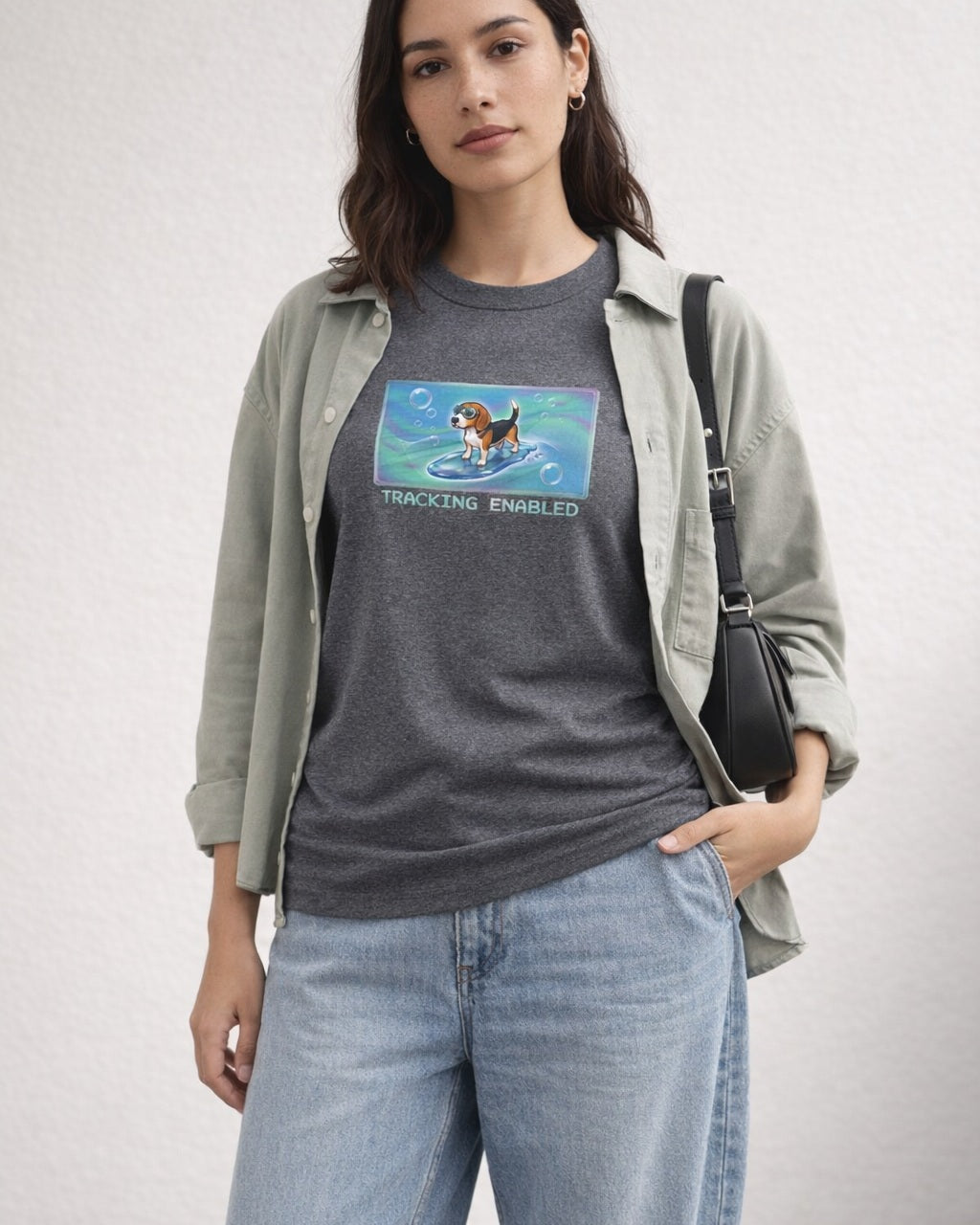 O's Tees Tracking Enabled Beagle Frutiger Aero Dogs graphic tee lifestyle image — Graphite Heather shirt, female shot 01, washed blue denim sage