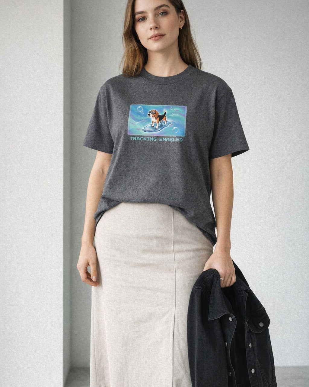 O's Tees Tracking Enabled Beagle Frutiger Aero Dogs graphic tee lifestyle image — Graphite Heather shirt, female shot 02, stone column skirt black jacket