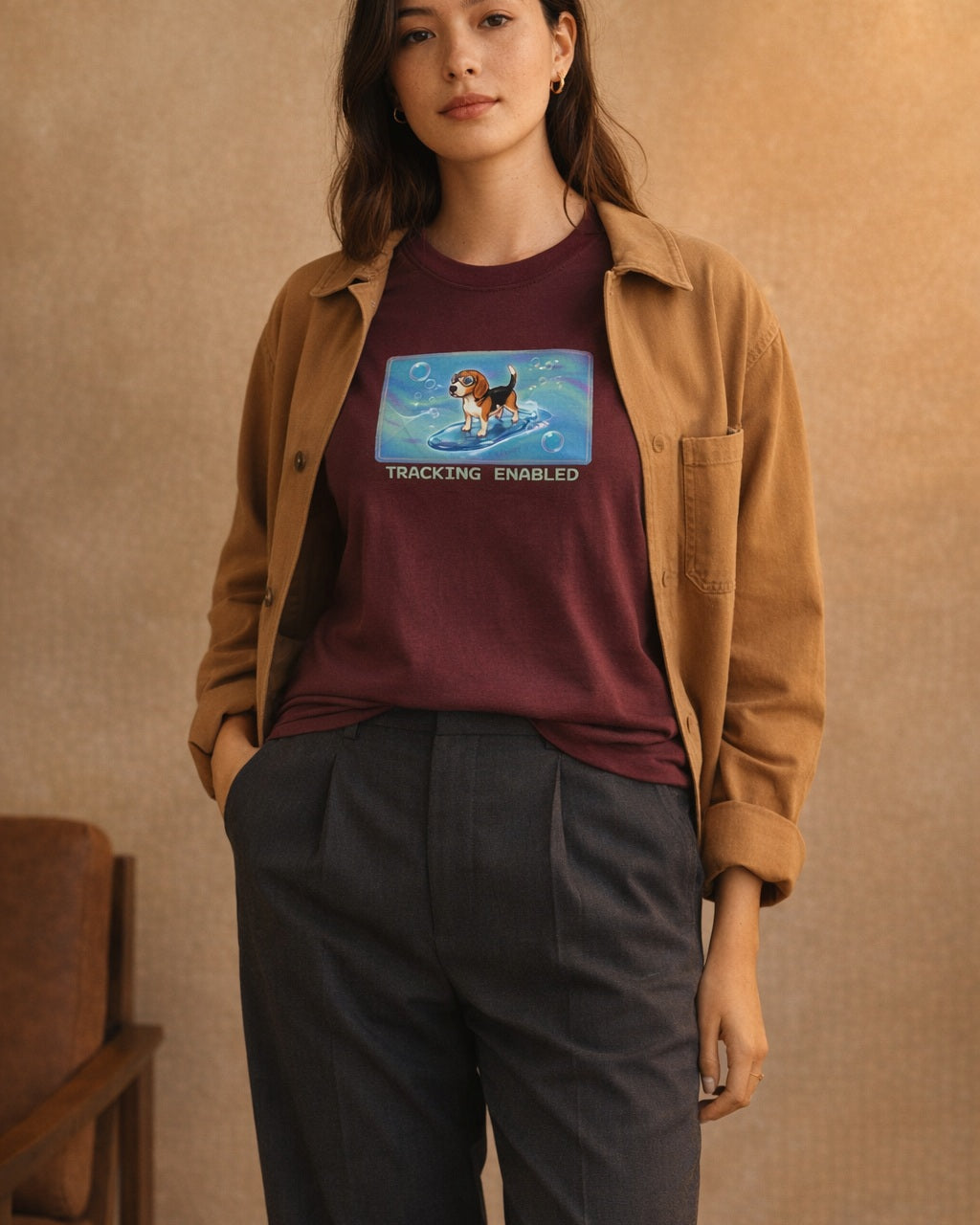 O's Tees Tracking Enabled Beagle Frutiger Aero Dogs graphic tee lifestyle image — Maroon shirt, female shot 02, charcoal trouser camel