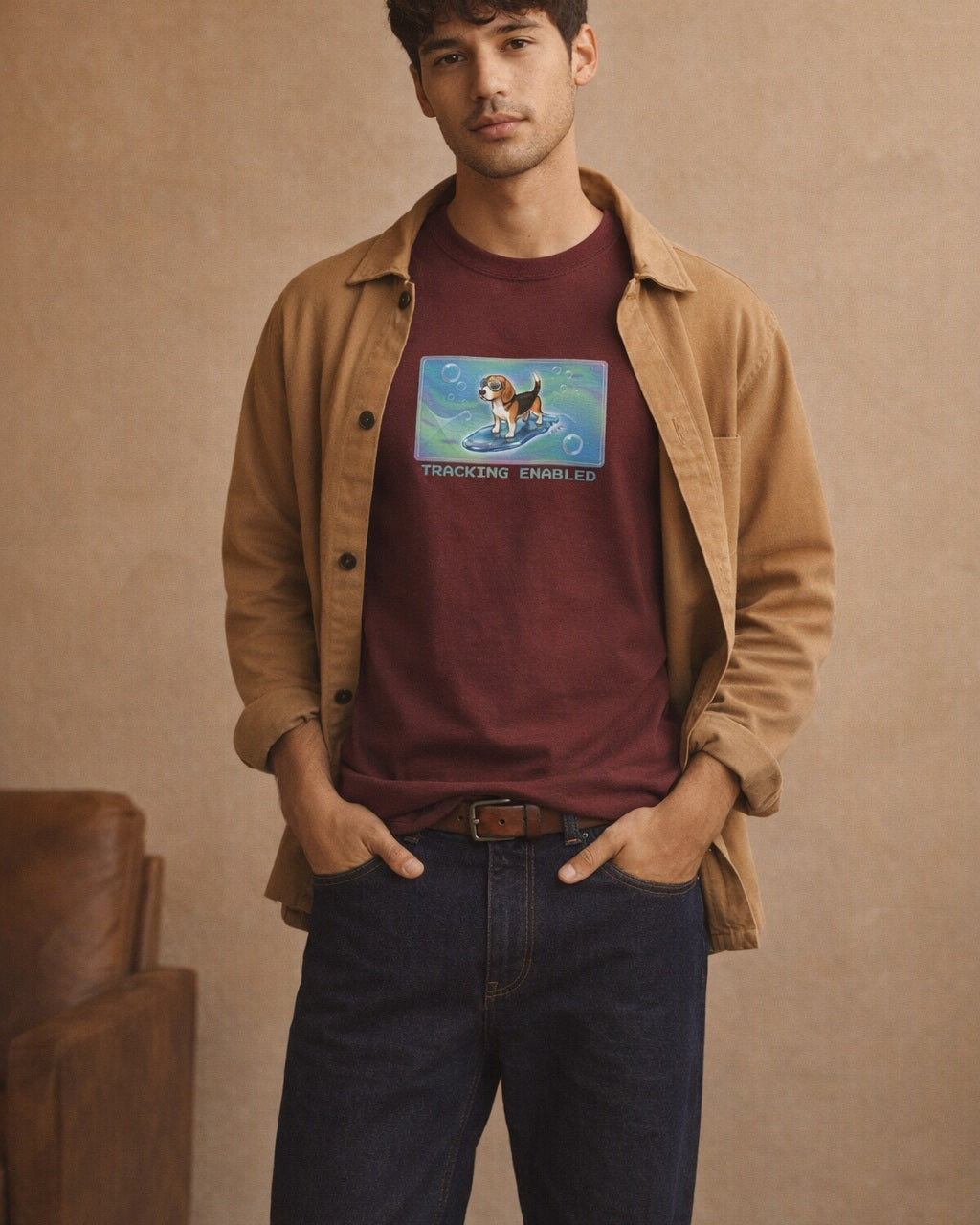 O's Tees Tracking Enabled Beagle Frutiger Aero Dogs graphic tee lifestyle image — Maroon shirt, male shot 01, raw denim camel