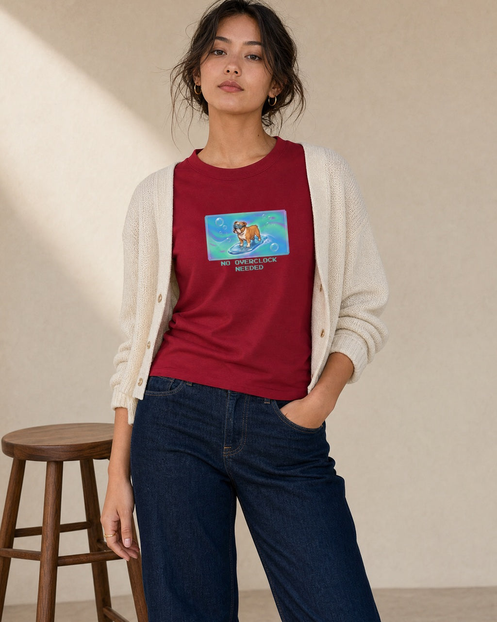 O's Tees No Overclock Needed Bulldog Frutiger Aero Dogs graphic tee lifestyle image — Cardinal Red shirt, female shot 01, dark indigo cream cardigan