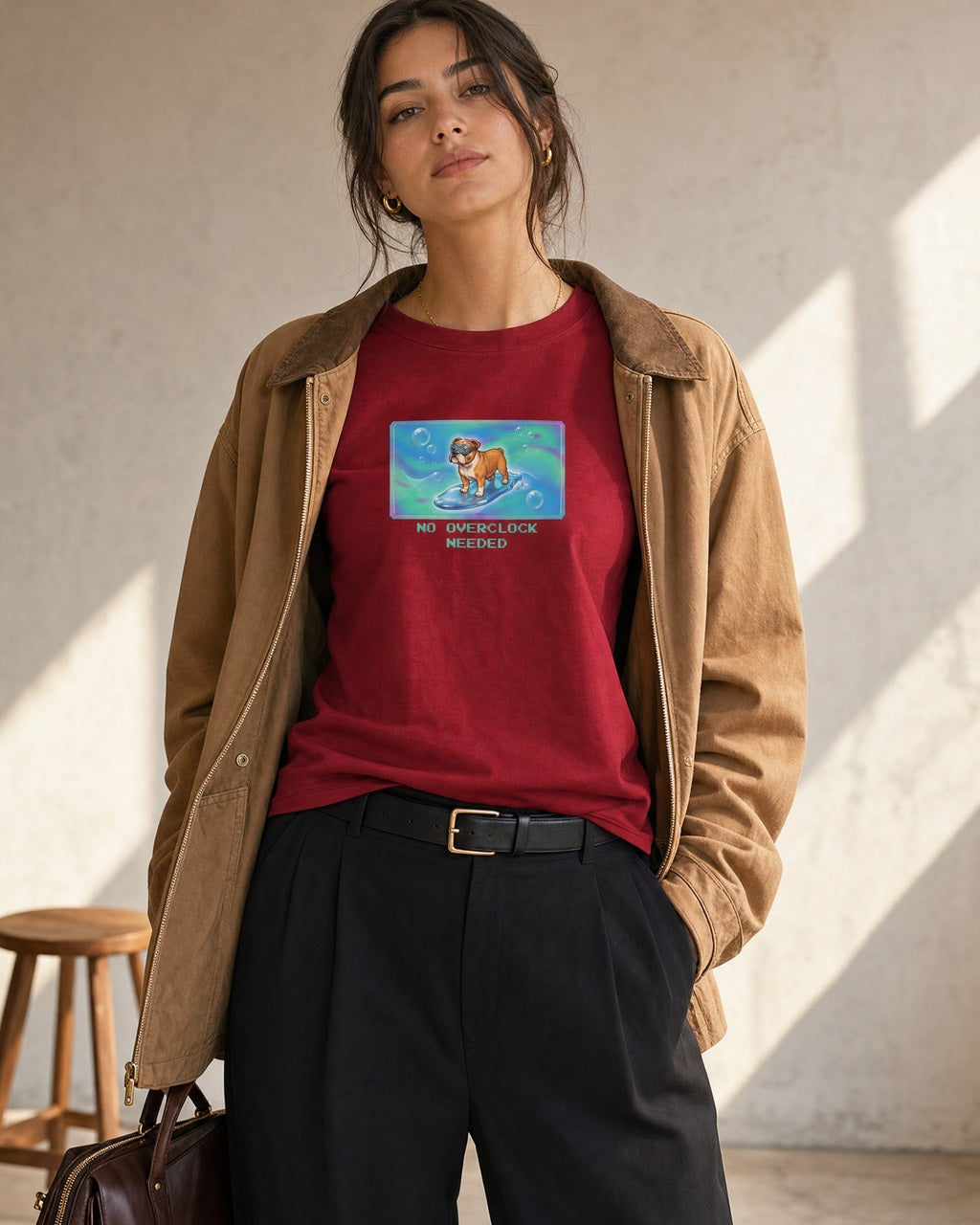 O's Tees No Overclock Needed Bulldog Frutiger Aero Dogs graphic tee lifestyle image — Cardinal Red shirt, female shot 02, black trouser camel jacket