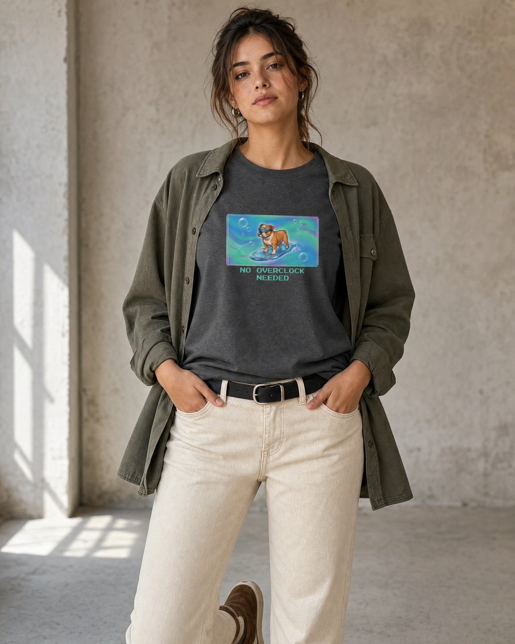 O's Tees No Overclock Needed Bulldog Frutiger Aero Dogs graphic tee lifestyle image — Dark Heather shirt, female shot 01, ecru denim olive overshirt