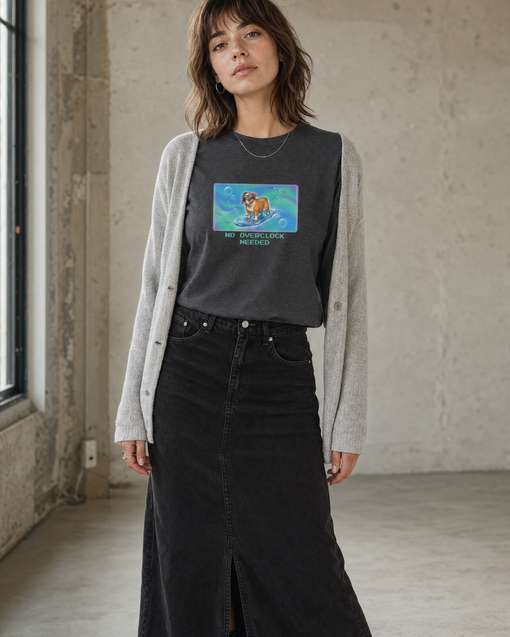 O's Tees No Overclock Needed Bulldog Frutiger Aero Dogs graphic tee lifestyle image — Dark Heather shirt, female shot 02, washed black column skirt