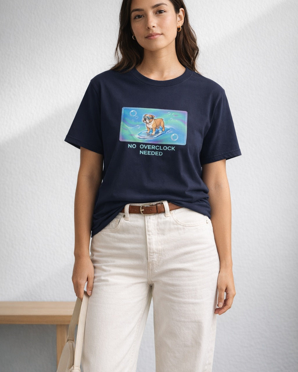 O's Tees No Overclock Needed Bulldog Frutiger Aero Dogs graphic tee lifestyle image — Navy shirt, female shot 01, ecru barrel tan suede