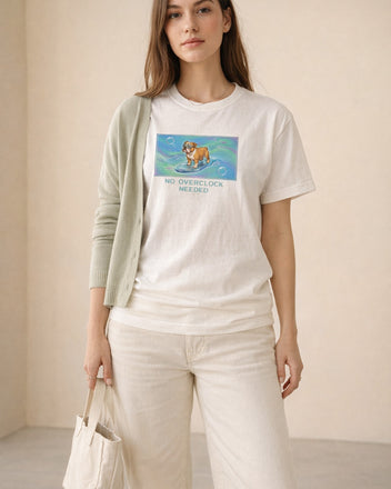 O's Tees No Overclock Needed Bulldog Frutiger Aero Dogs graphic tee lifestyle image — White shirt, female shot 02, sage cardigan cream denim
