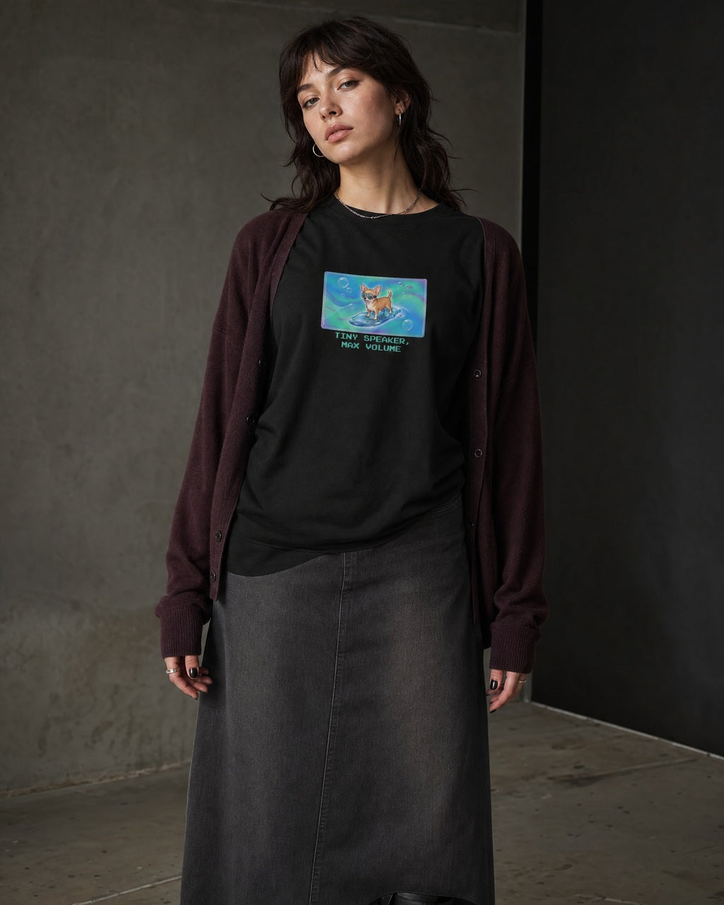 O's Tees Tiny Speaker, Max Volume Chihuahua Frutiger Aero Dogs graphic tee lifestyle image — Black shirt, female shot 02, charcoal maxi plum