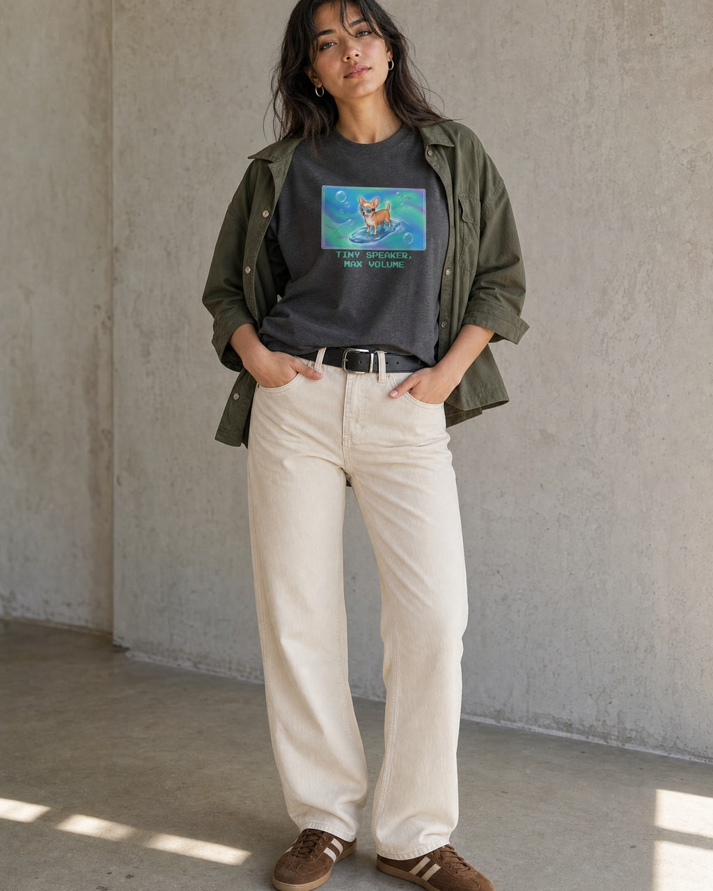 O's Tees Tiny Speaker, Max Volume Chihuahua Frutiger Aero Dogs graphic tee lifestyle image — Dark Heather shirt, female shot 01, ecru denim olive overshirt