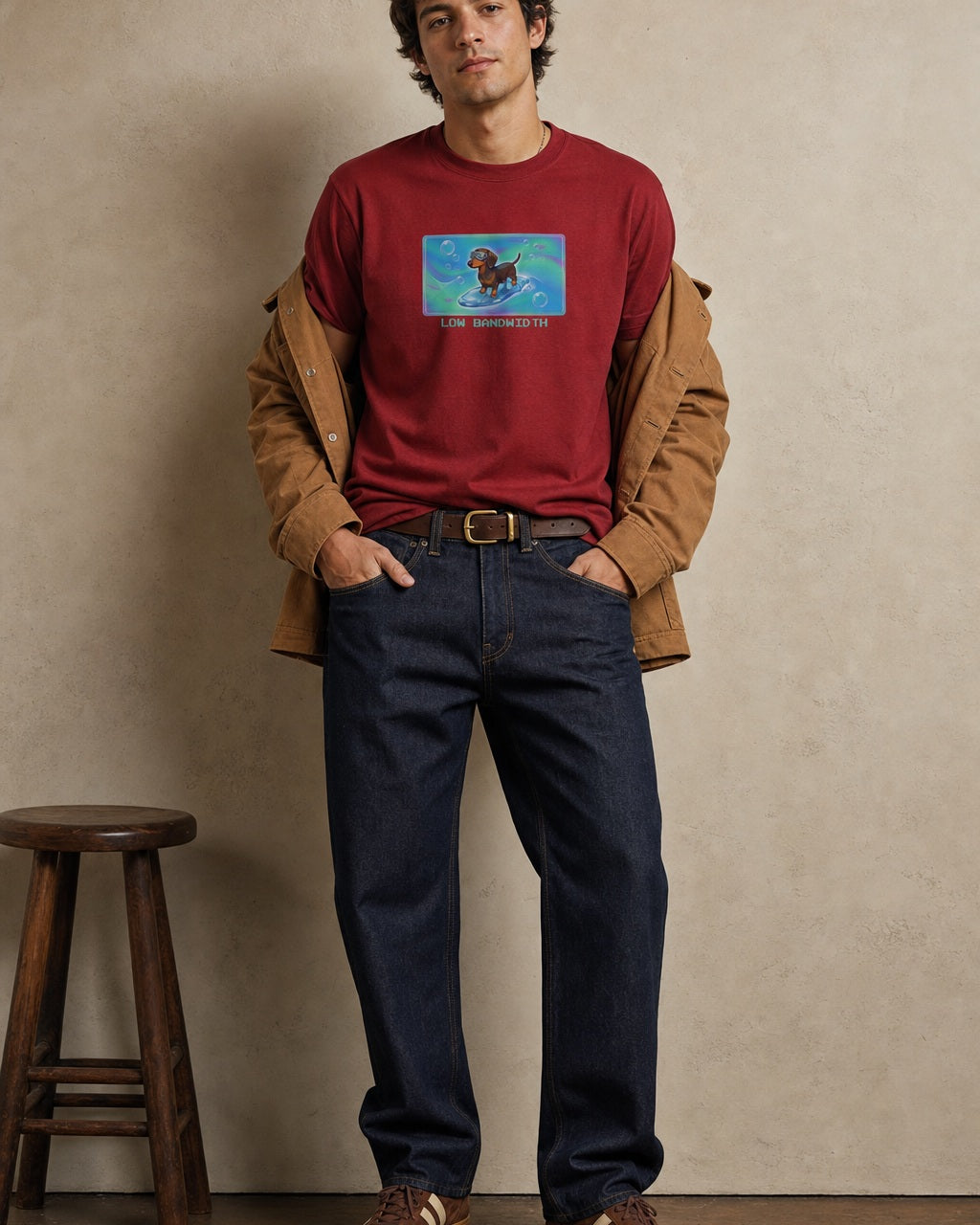O's Tees Low Bandwidth Dachshund Frutiger Aero Dogs graphic tee lifestyle image — Cardinal Red shirt, male shot 01, raw denim camel chore