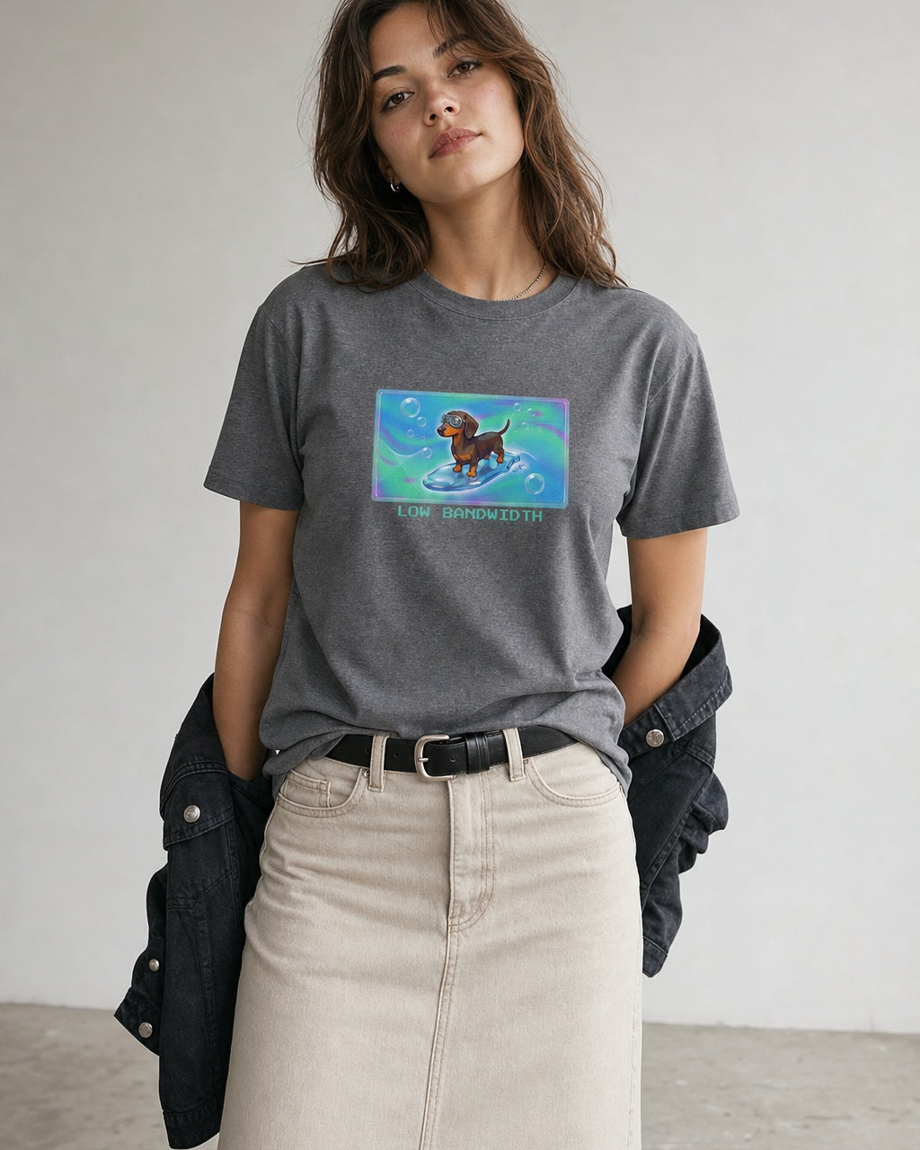 O's Tees Low Bandwidth Dachshund Frutiger Aero Dogs graphic tee lifestyle image — Graphite Heather shirt, female shot 02, stone column skirt black jacket