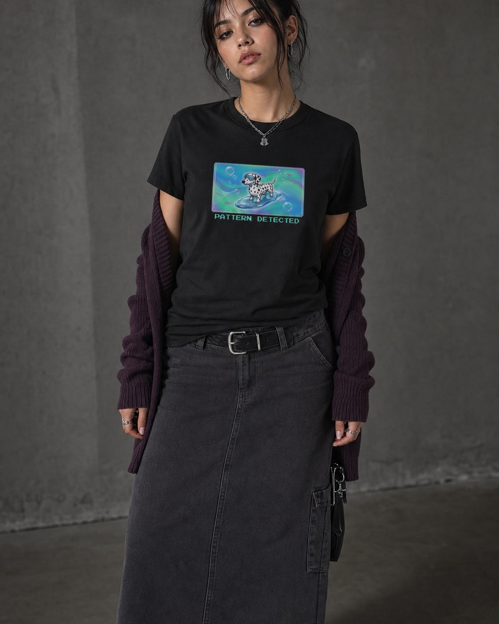 O's Tees Pattern Detected Dalmatian Frutiger Aero Dogs graphic tee lifestyle image — Black shirt, female shot 02, charcoal maxi plum