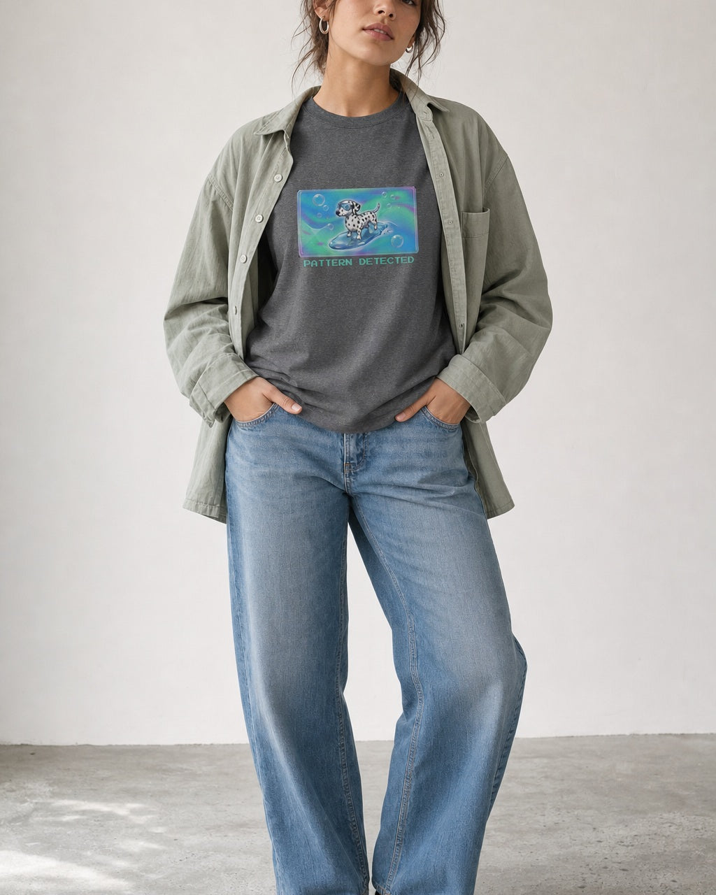 O's Tees Pattern Detected Dalmatian Frutiger Aero Dogs graphic tee lifestyle image — Graphite Heather shirt, female shot 01, washed blue denim sage