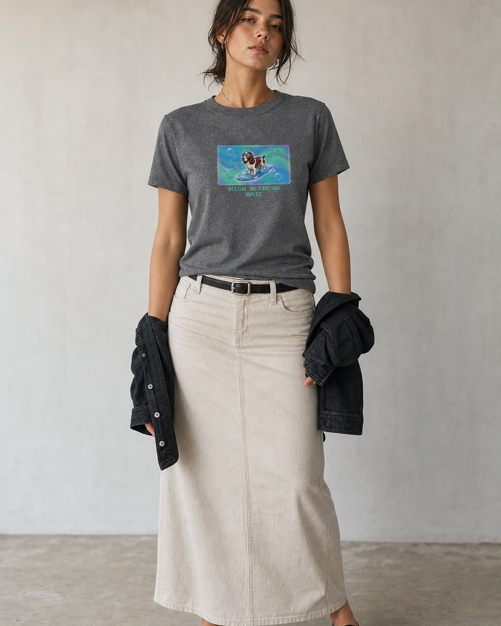 O's Tees High Refresh Rate English Springer Spaniel Frutiger Aero Dogs graphic tee lifestyle image — Graphite Heather shirt, female shot 02, stone column skirt black jacket
