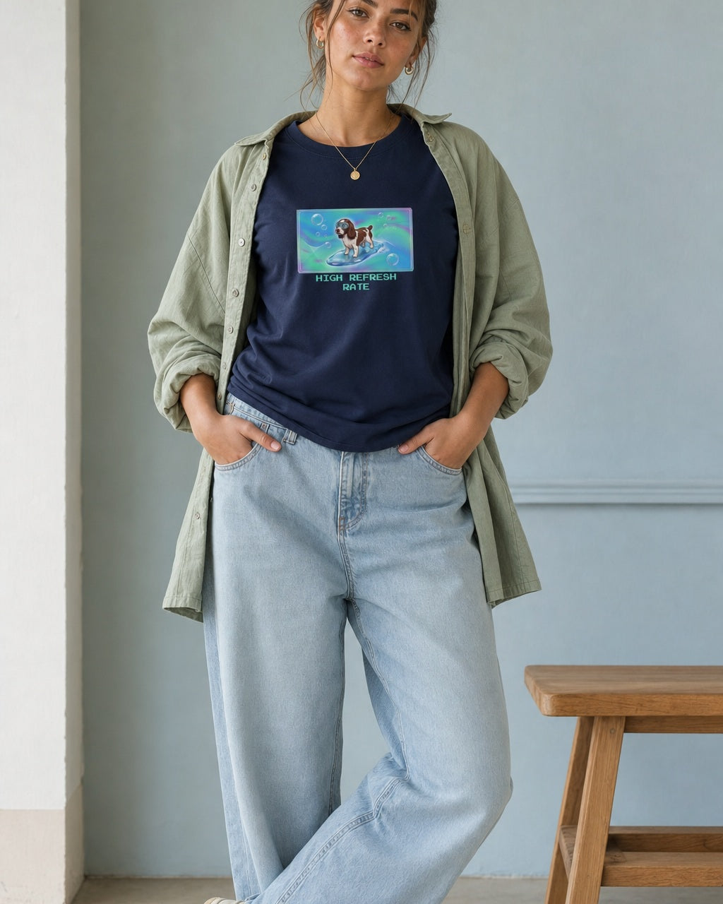 O's Tees High Refresh Rate English Springer Spaniel Frutiger Aero Dogs graphic tee lifestyle image — Navy shirt, female shot 02, lightwash sage
