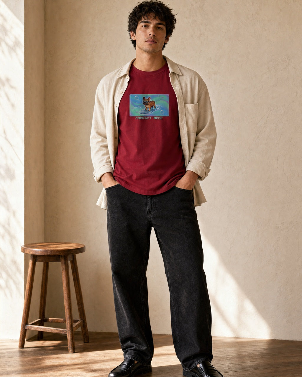 O's Tees Compact Mode French Bulldog Frutiger Aero Dogs graphic tee lifestyle image — Cardinal Red shirt, male shot 02, black jeans cream overshirt