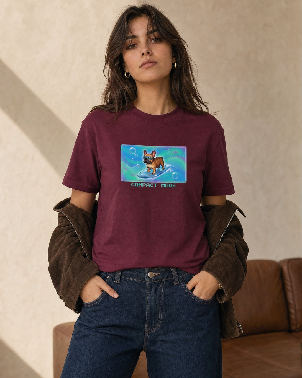 O's Tees Compact Mode French Bulldog Frutiger Aero Dogs graphic tee lifestyle image — Maroon shirt, female shot 01, deep indigo chocolate