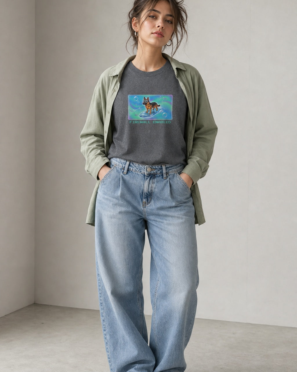 O's Tees Firewall Enabled German Shepherd Frutiger Aero Dogs graphic tee lifestyle image — Graphite Heather shirt, female shot 01, washed blue denim sage