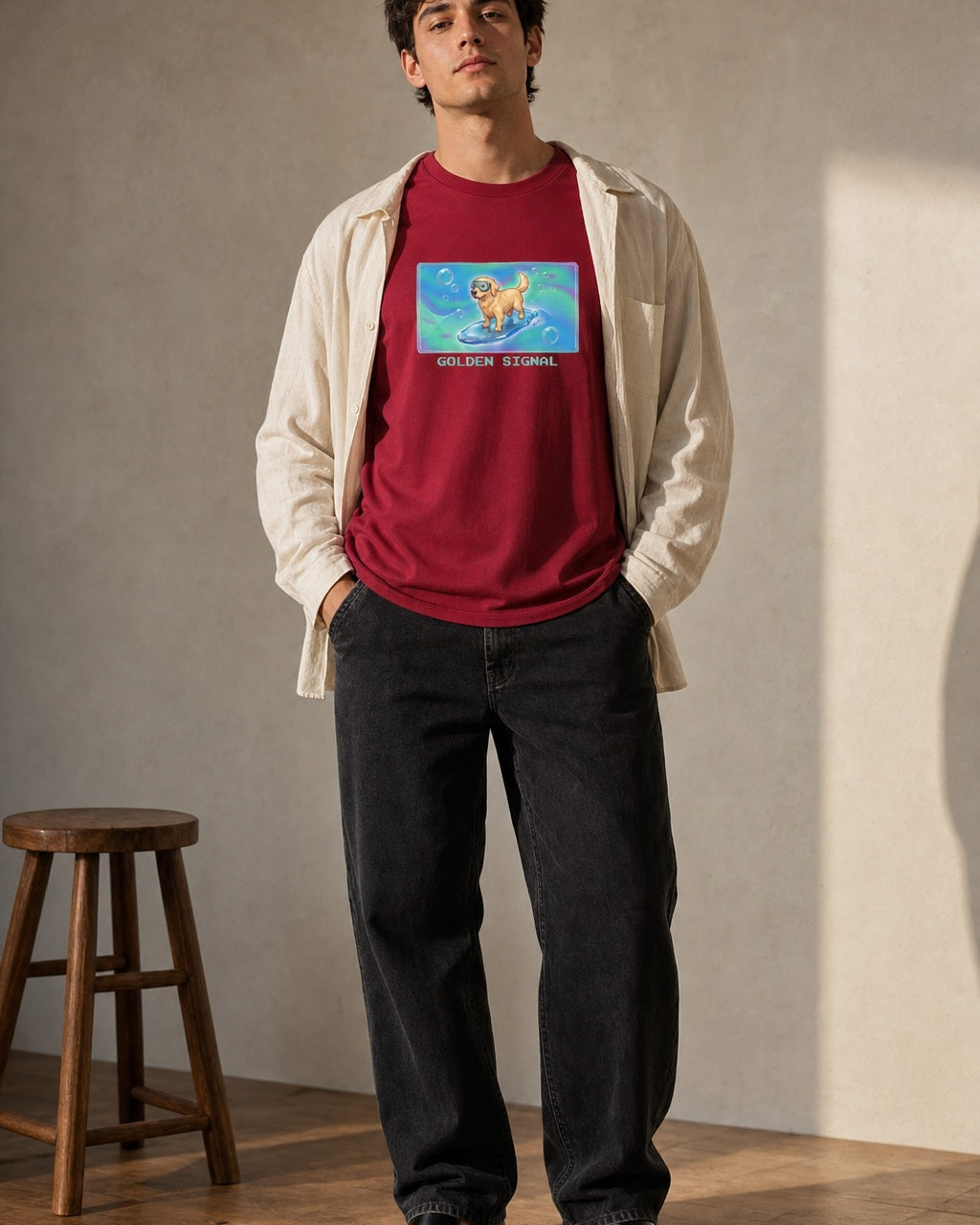 O's Tees Golden Signal Golden Retriever Frutiger Aero Dogs graphic tee lifestyle image — Cardinal Red shirt, male shot 02, black jeans cream overshirt