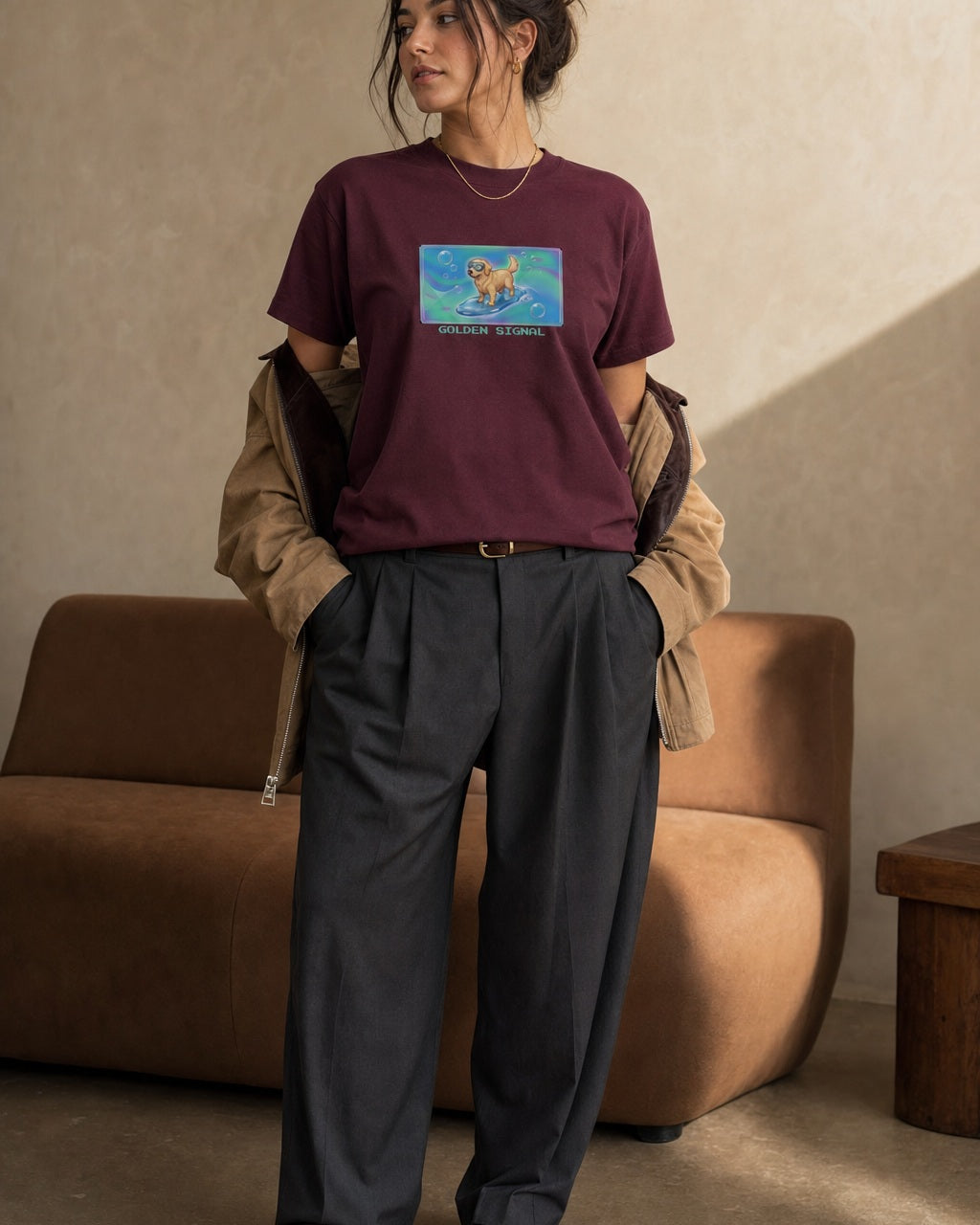 O's Tees Golden Signal Golden Retriever Frutiger Aero Dogs graphic tee lifestyle image — Maroon shirt, female shot 02, charcoal trouser camel