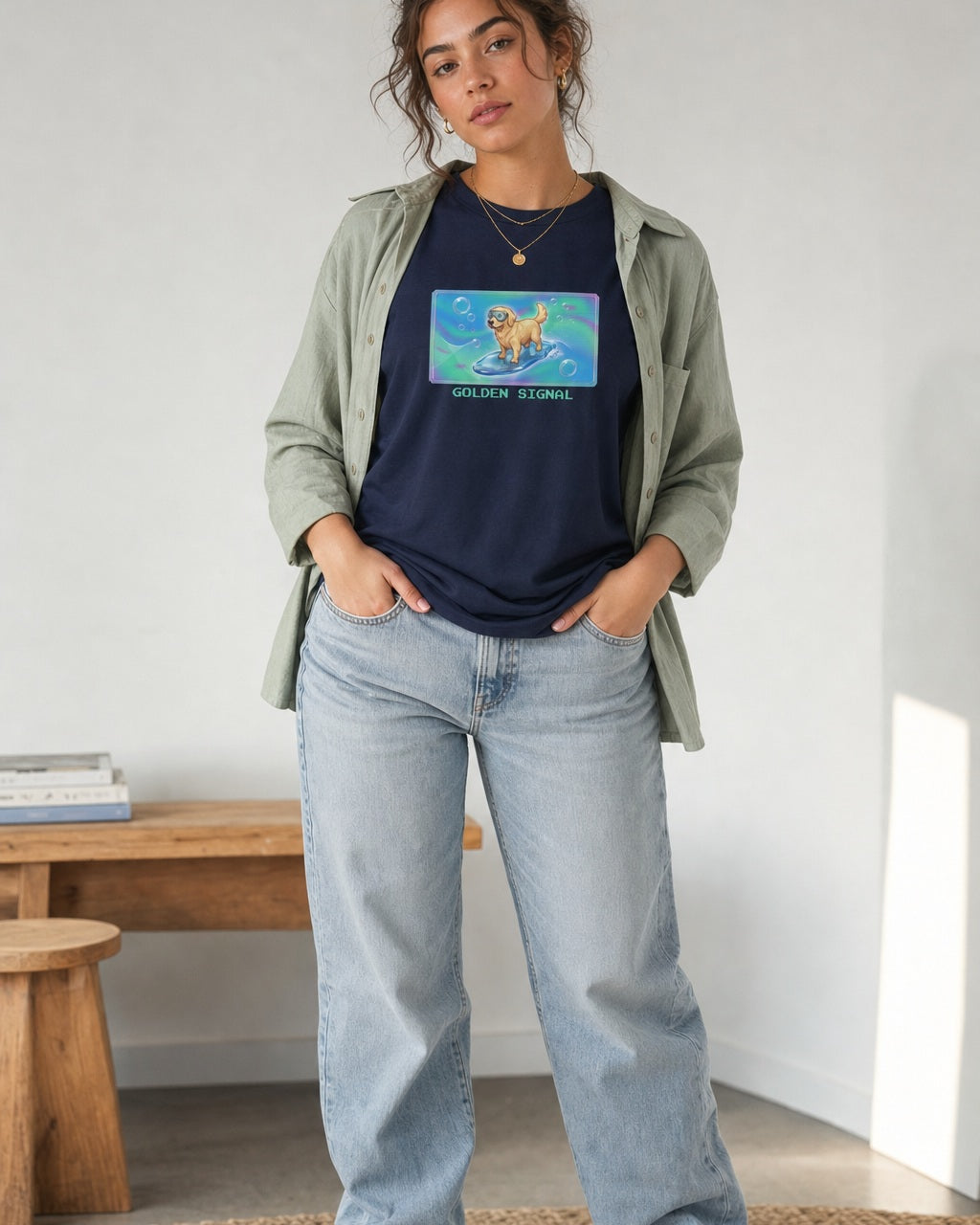 O's Tees Golden Signal Golden Retriever Frutiger Aero Dogs graphic tee lifestyle image — Navy shirt, female shot 02, lightwash sage