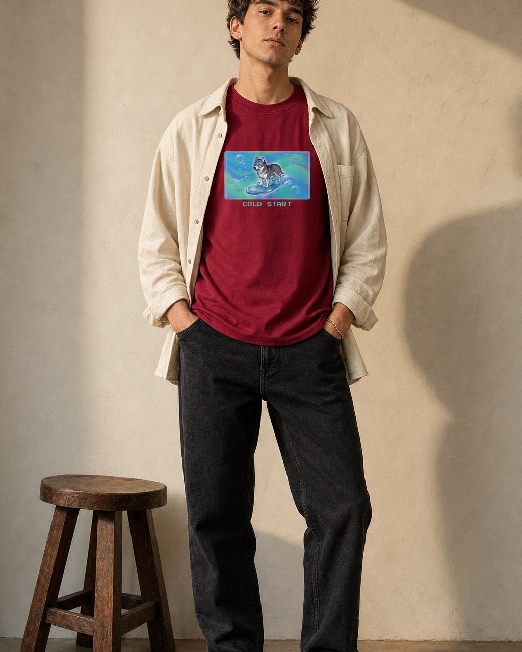 O's Tees Cold Start Husky Frutiger Aero Dogs graphic tee lifestyle image — Cardinal Red shirt, male shot 02, black jeans cream overshirt