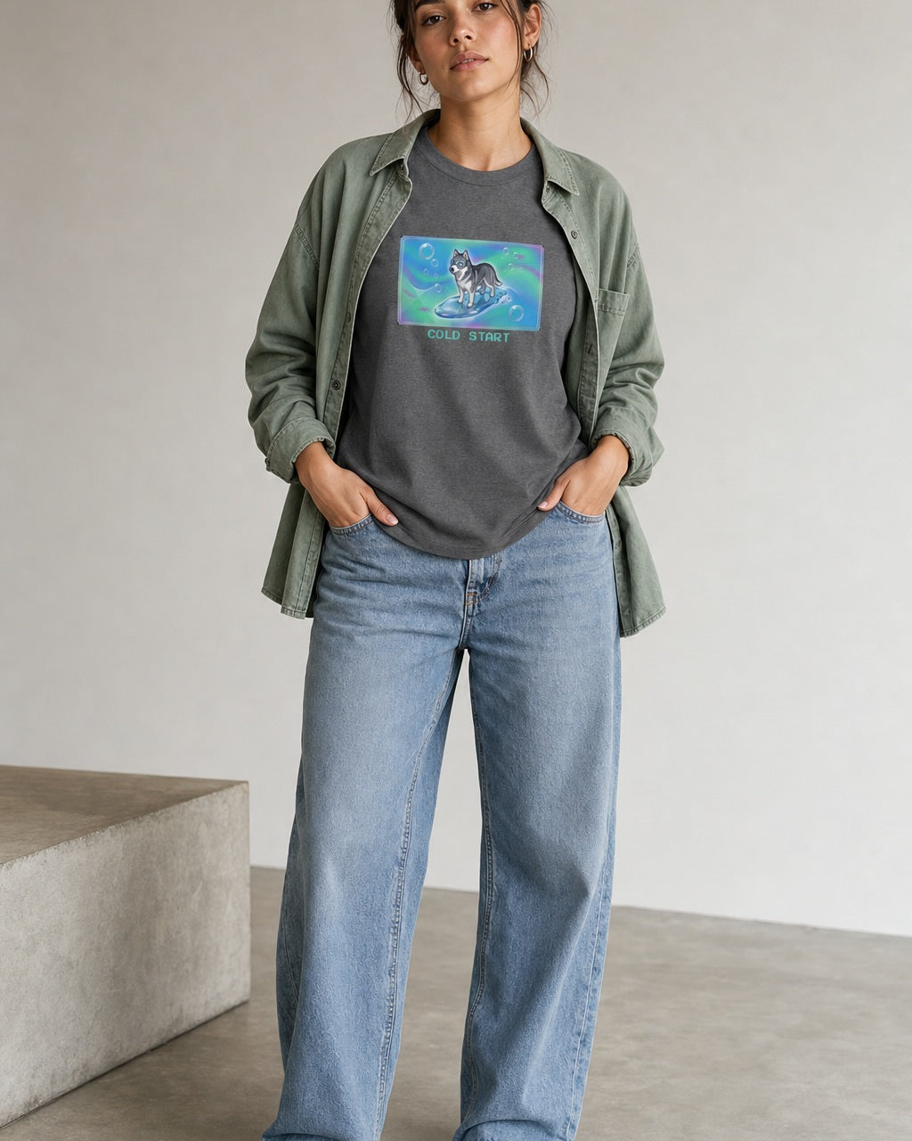 O's Tees Cold Start Husky Frutiger Aero Dogs graphic tee lifestyle image — Graphite Heather shirt, female shot 01, washed blue denim sage