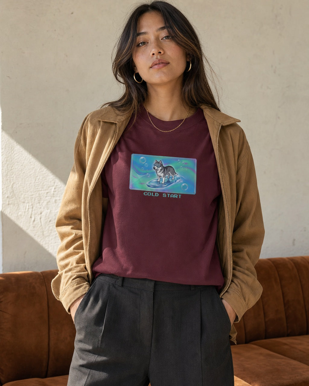 O's Tees Cold Start Husky Frutiger Aero Dogs graphic tee lifestyle image — Maroon shirt, female shot 02, charcoal trouser camel